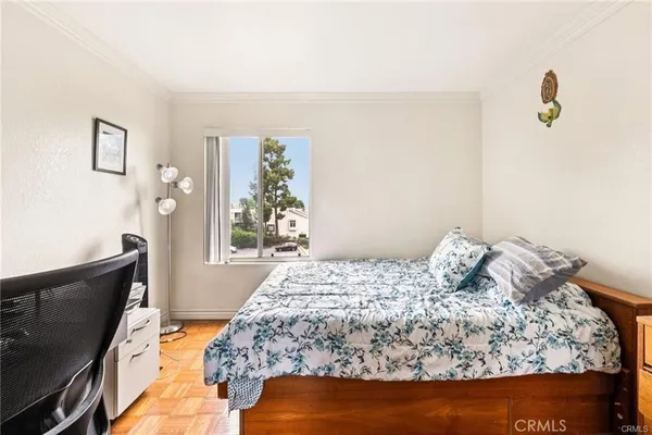 a bedroom with a bed and sliding door