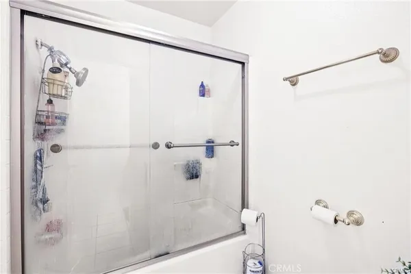 a bathroom with a shower and a shower
