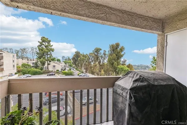 a view of a balcony with wooden fence