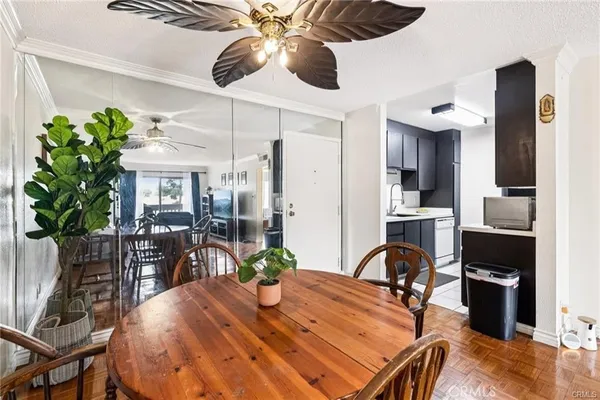 a dining room with furniture and chandelier
