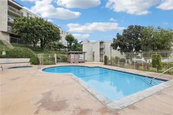 a view of a swimming pool with a patio