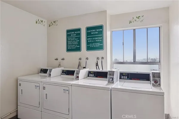a kitchen with a sink cabinets and a window