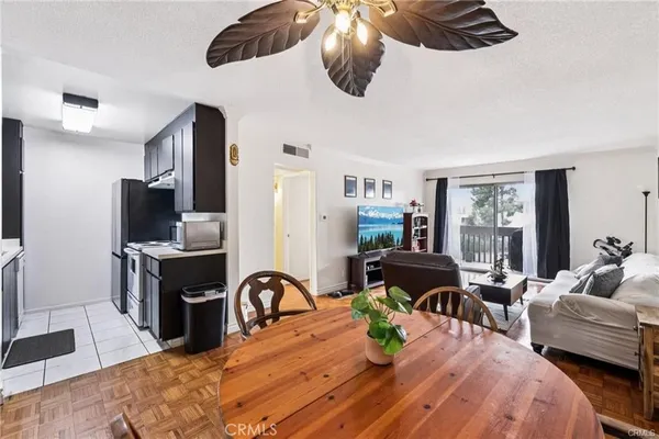 a bedroom with furniture and a flat screen tv
