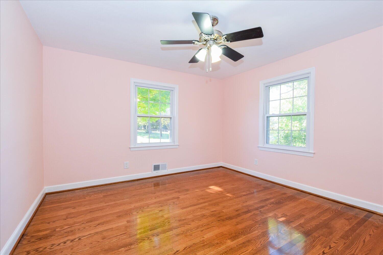 3703 Cove Road Roanoke, VA 24017 - Photo 11 of 27 a view of an empty room with wooden floor and a window