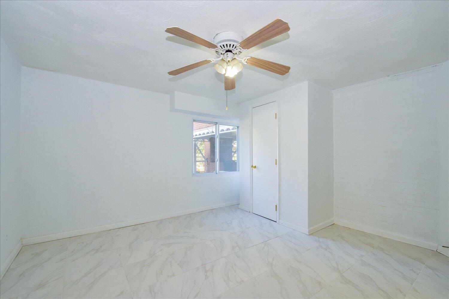3703 Cove Road Roanoke, VA 24017 - Photo 17 of 27 a view of an empty room with a window