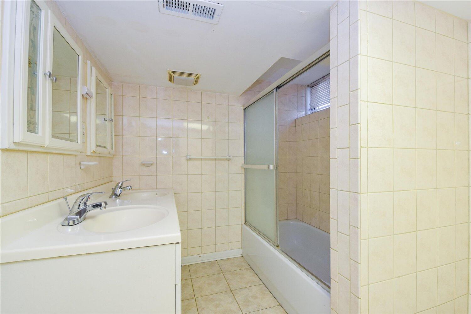 3703 Cove Road Roanoke, VA 24017 - Photo 18 of 27 a bathroom with a sink a toilet and shower