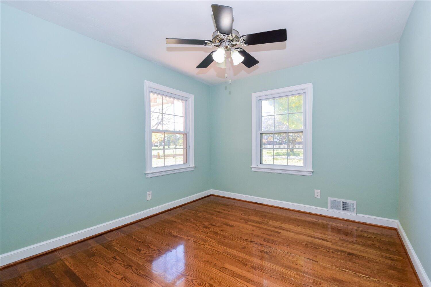 3703 Cove Road Roanoke, VA 24017 - Photo 10 of 27 a view of an empty room with wooden floor and a window