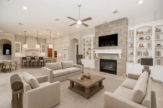 a living room with furniture fireplace and a flat screen tv