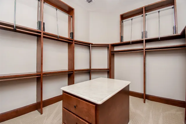 a kitchen with a cabinets and wooden floor