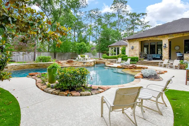 a view of a swimming pool with a lounge chairs