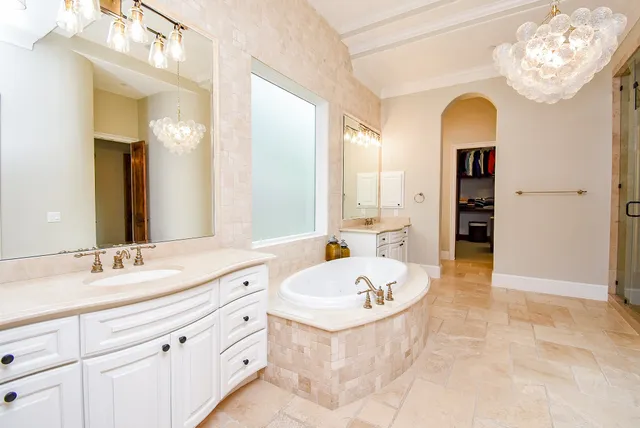 a bathroom with a sink a vanity and a mirror