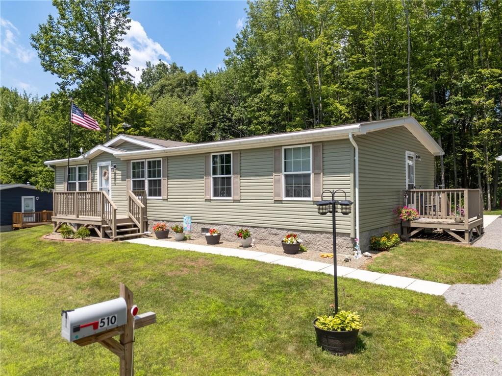 73 South Summit Road, Unit 510 Greenville, PA 16125 - Photo 3 of 33 a backyard of a house with table and chairs