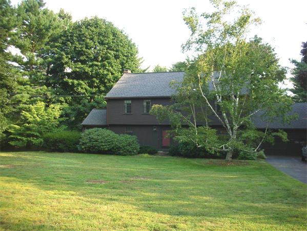 115 Moore Road Sudbury, MA 01776 - Photo 1 of 12 a front view of a house with a yard