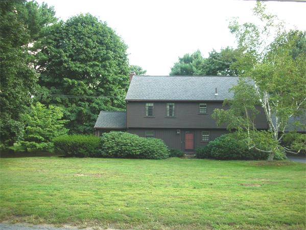 115 Moore Road Sudbury, MA 01776 - Photo 2 of 12 a front view of a house with a yard