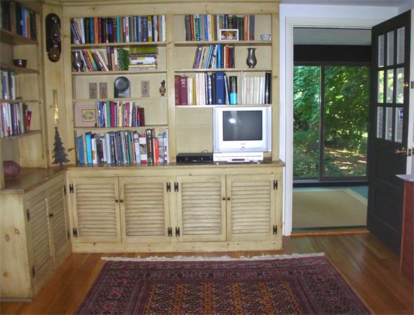 115 Moore Road Sudbury, MA 01776 - Photo 6 of 12 a view of a book shelf with wooden floor