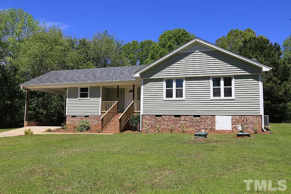 3312 High Gate Road Raleigh, NC 27603 - Photo 1 of 22 a front view of a house with a yard