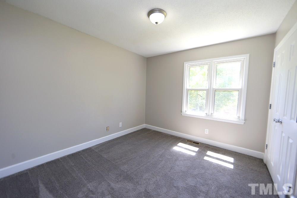 3312 High Gate Road Raleigh, NC 27603 - Photo 15 of 22 an empty room with a window