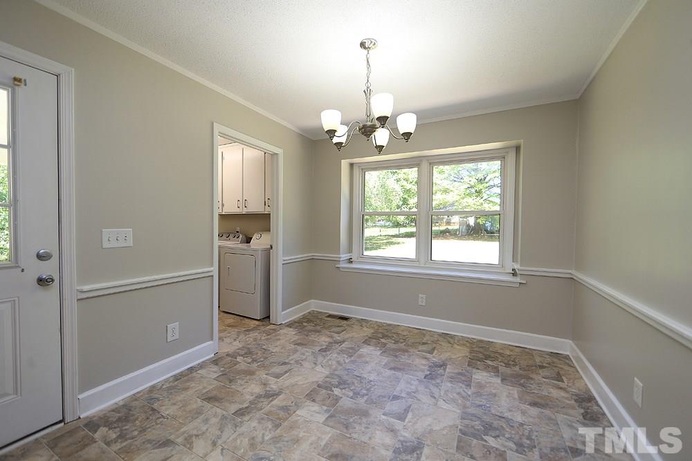 3312 High Gate Road Raleigh, NC 27603 - Photo 3 of 22 wooden floor in an empty room with a window