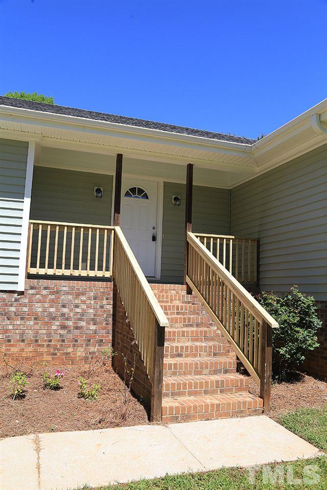 3312 High Gate Road Raleigh, NC 27603 - Photo 6 of 22 a view of staircase with railing and white walls