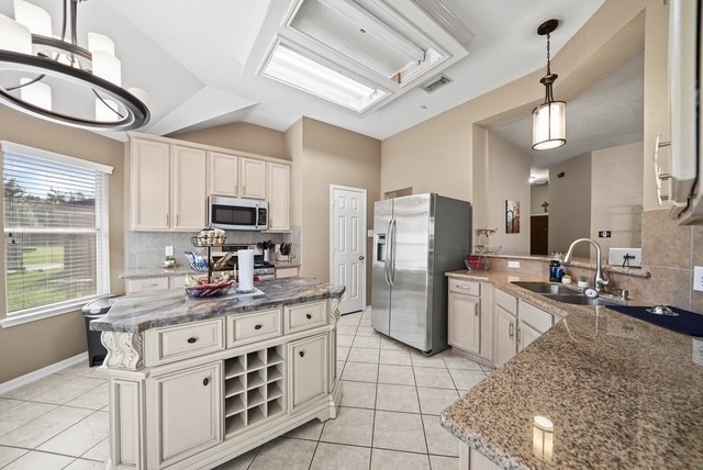 3103 Valley Court Manvel, TX 77578 - Photo 12 of 20 a kitchen that has a lot of cabinets in it and appliances