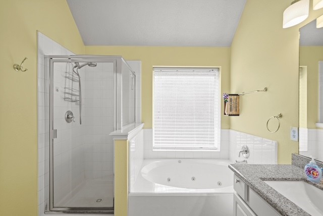 3103 Valley Court Manvel, TX 77578 - Photo 18 of 20 a bathroom with a granite countertop sink and a bathtub