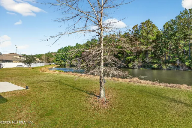 a view of a lake with a yard