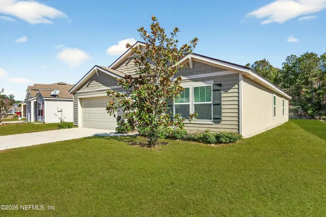 a front view of a house with a yard
