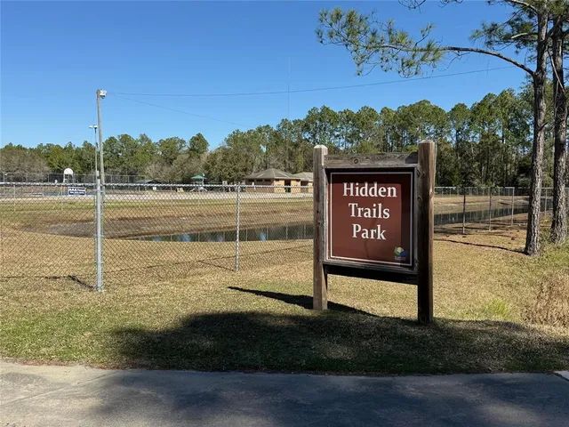 a view of a street with a bench in the background