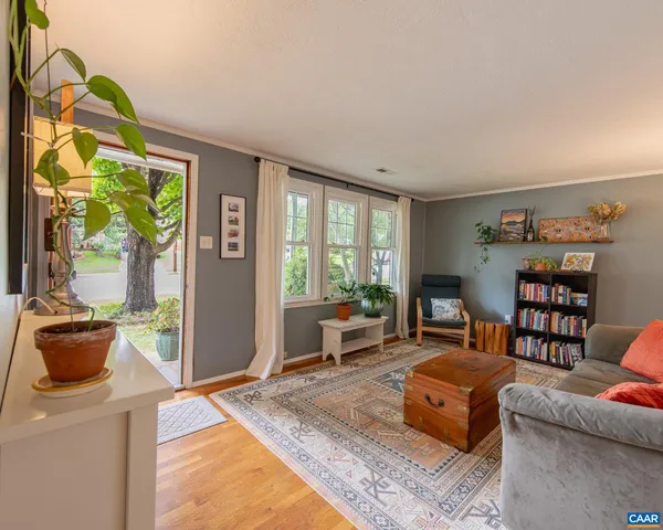a kitchen with a sink and chairs