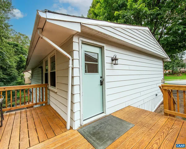 a bathroom with a sink a toilet and shower curtain