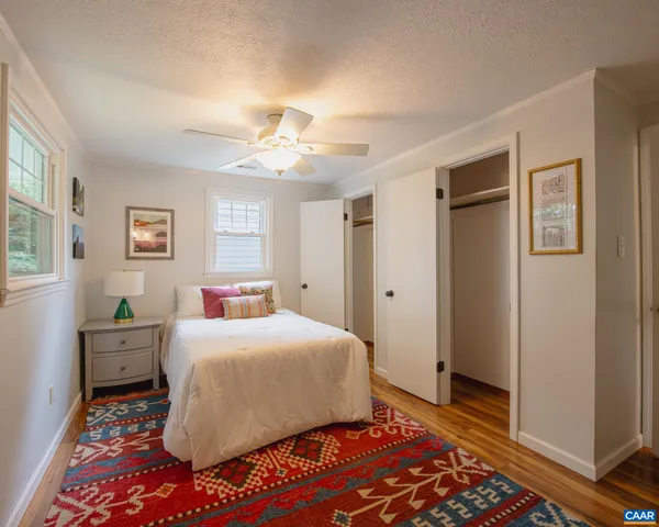 a bathroom with a sink mirror toilet and shower
