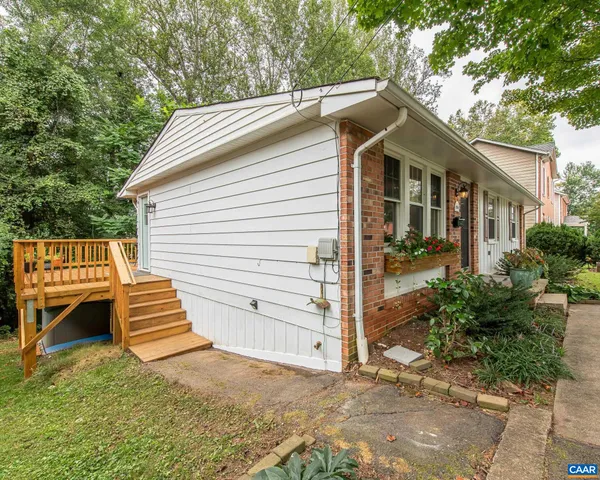 a view of a house with a tree in the background