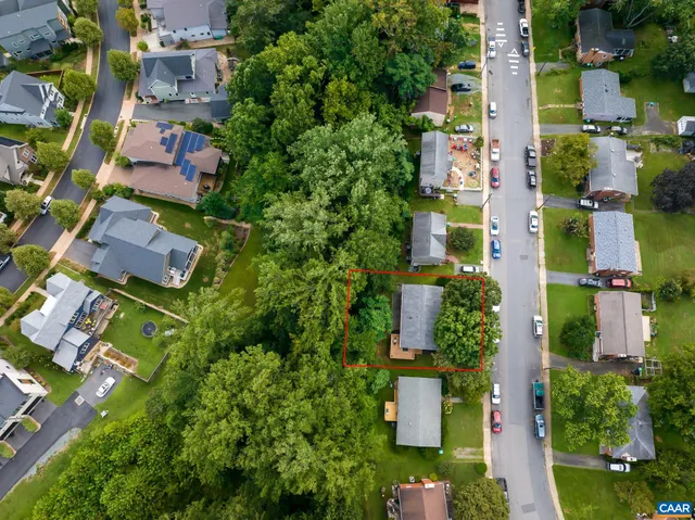 a front view of a house with a yard and outdoor seating