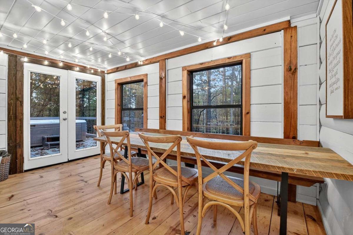 50 Lake View Drive, Unit 26 Blue Ridge, GA 30513 - Photo 13 of 33 a view of a dining room with furniture wooden floor and chandelier