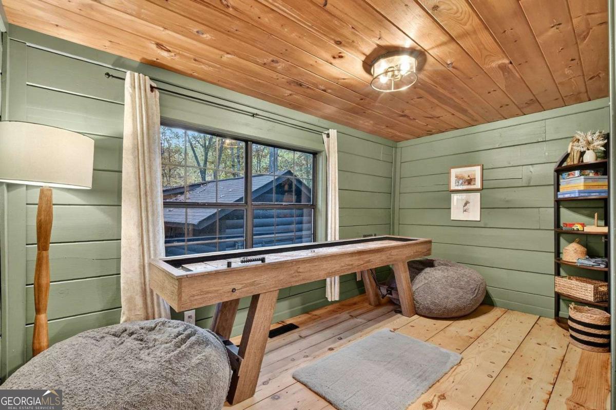 50 Lake View Drive, Unit 26 Blue Ridge, GA 30513 - Photo 17 of 33 a backyard of a house with seating space