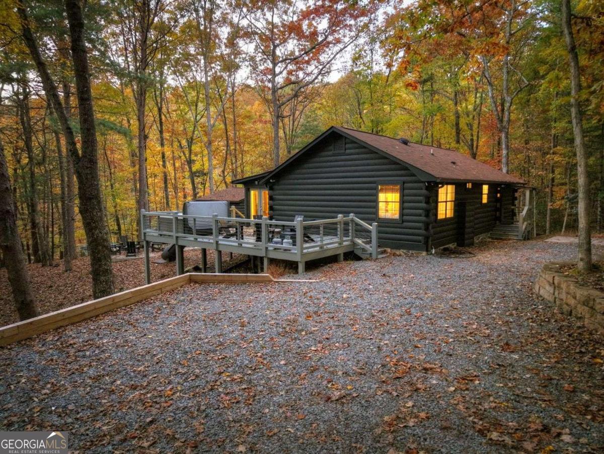 50 Lake View Drive, Unit 26 Blue Ridge, GA 30513 - Photo 2 of 33 a view of backyard with wooden fence and large trees