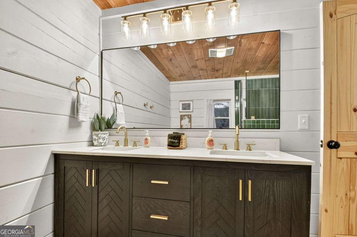 50 Lake View Drive, Unit 26 Blue Ridge, GA 30513 - Photo 22 of 33 a bathroom with a sink and a mirror