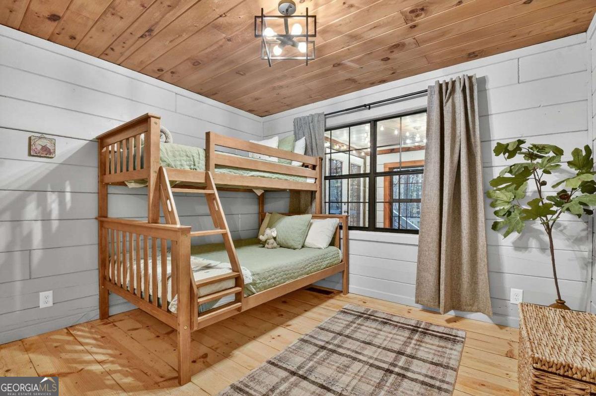 50 Lake View Drive, Unit 26 Blue Ridge, GA 30513 - Photo 23 of 33 a bedroom with furniture and window