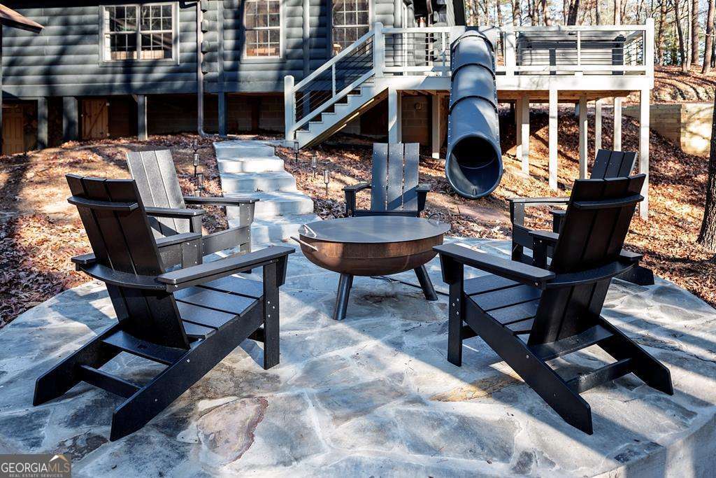 50 Lake View Drive, Unit 26 Blue Ridge, GA 30513 - Photo 6 of 33 a view of a chairs and table in patio