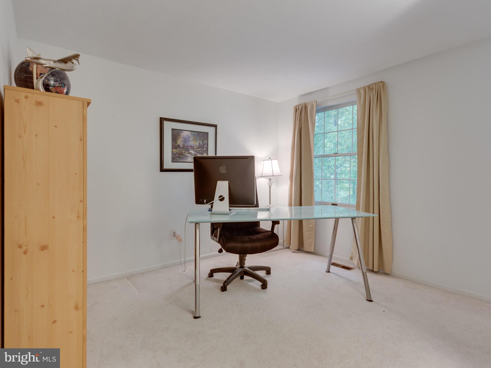 7817 Roundabout Way Springfield, VA 22153 - Photo 17 of 30 a view of a workspace with furniture and a window