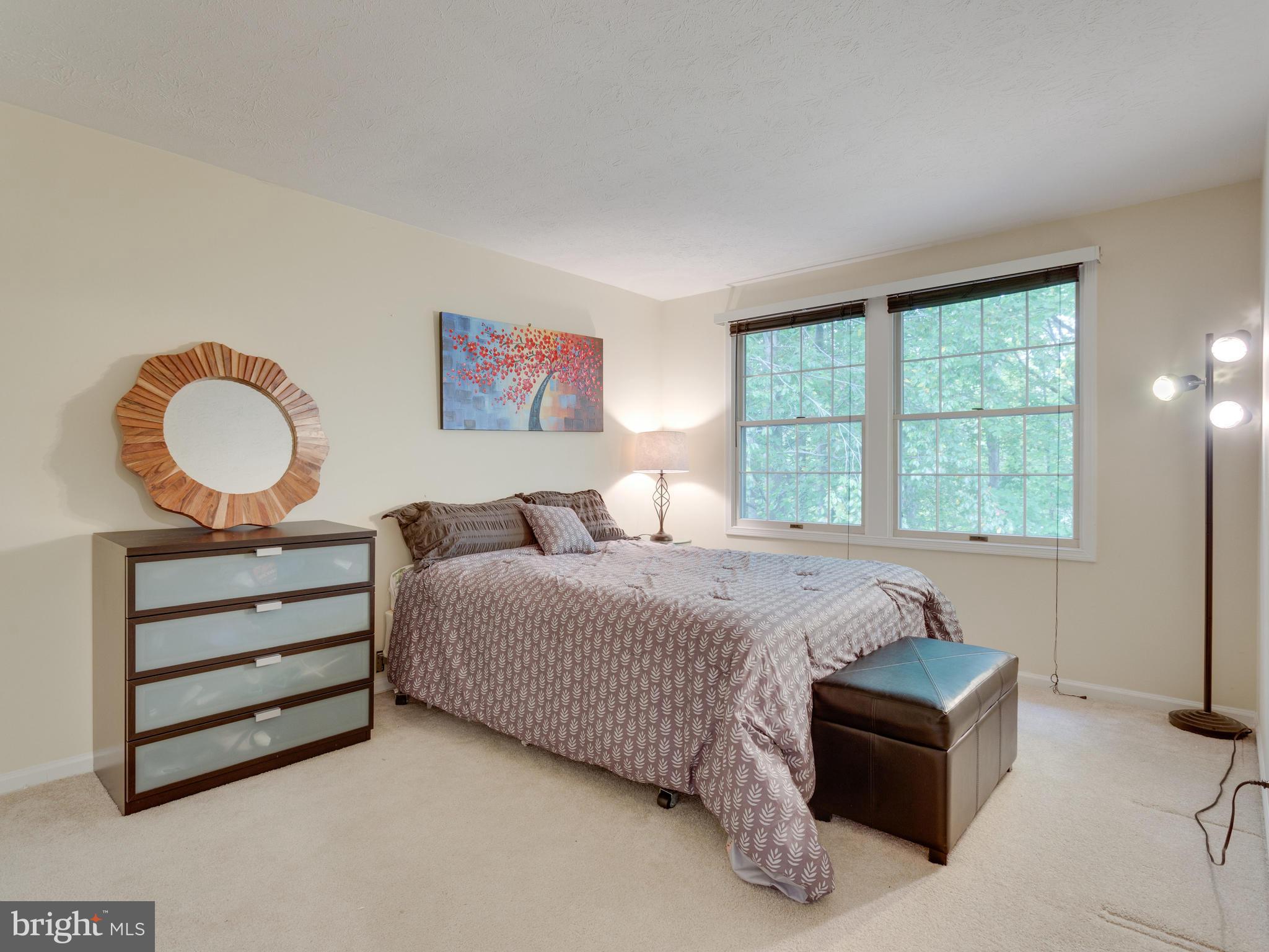 7817 Roundabout Way Springfield, VA 22153 - Photo 18 of 30 a bedroom with bed and wooden floor