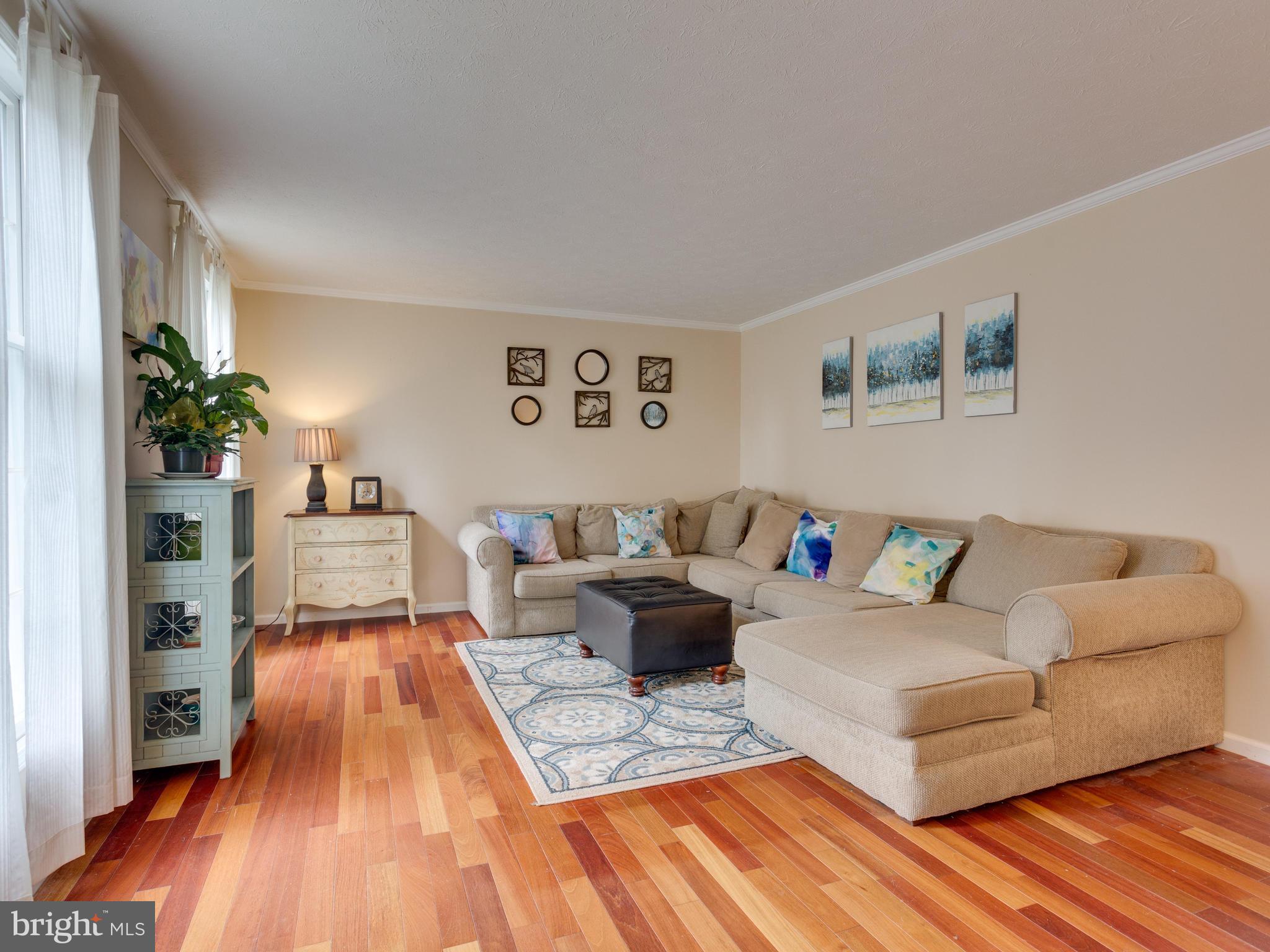 7817 Roundabout Way Springfield, VA 22153 - Photo 3 of 30 a living room with furniture and a wooden floor