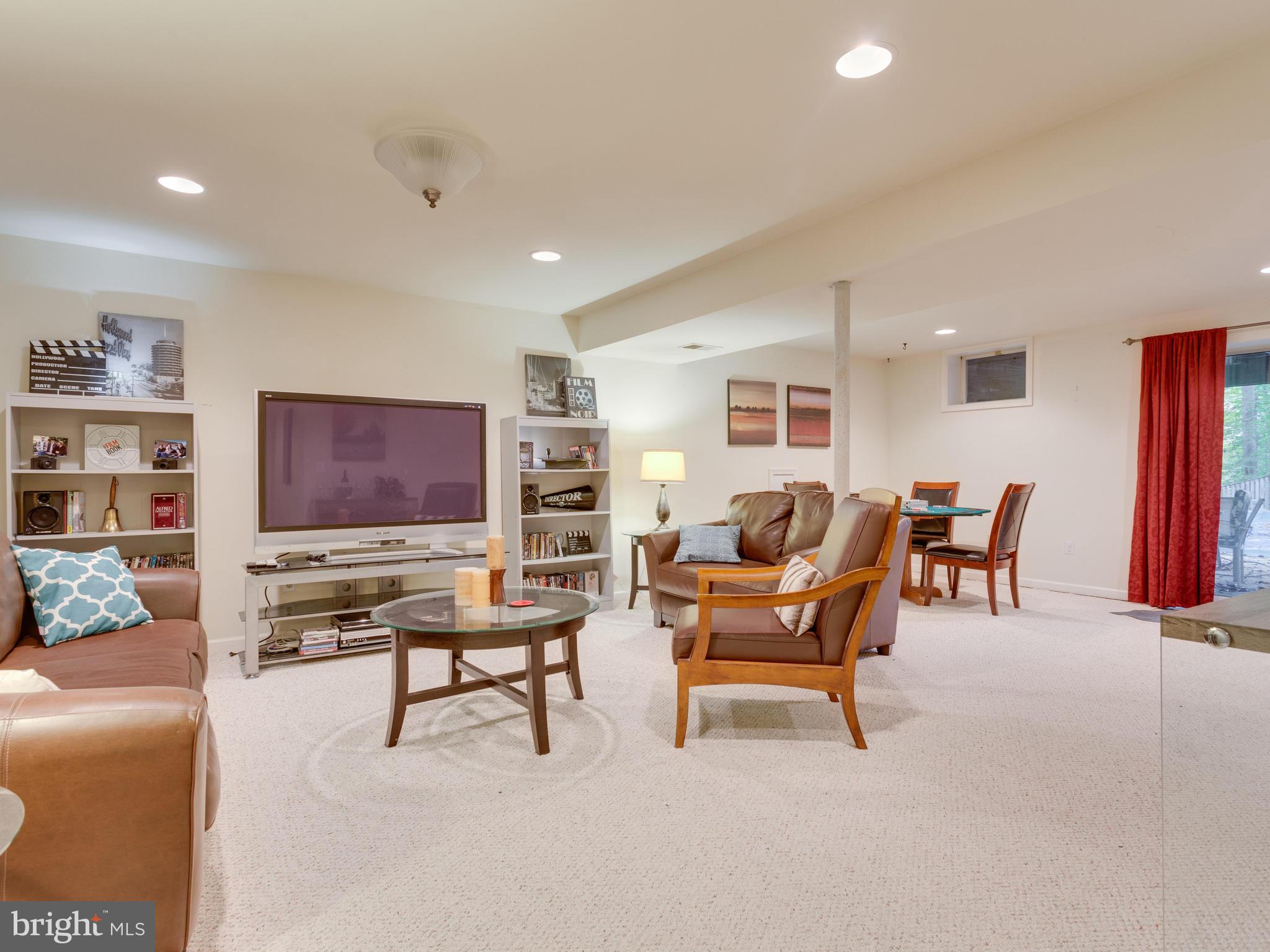 7817 Roundabout Way Springfield, VA 22153 - Photo 21 of 30 a living room with furniture and a flat screen tv