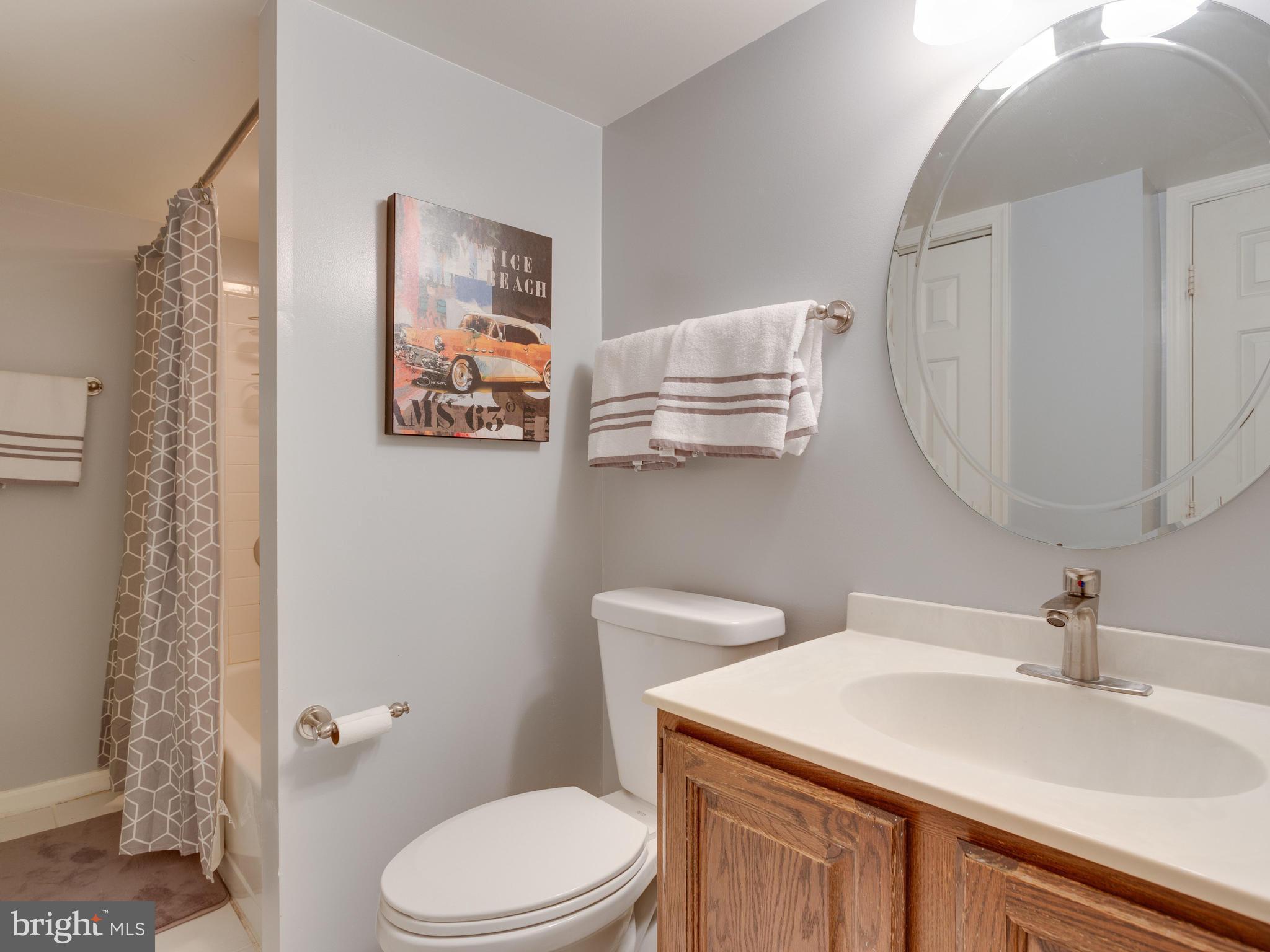 7817 Roundabout Way Springfield, VA 22153 - Photo 25 of 30 a bathroom with a sink a toilet and a mirror