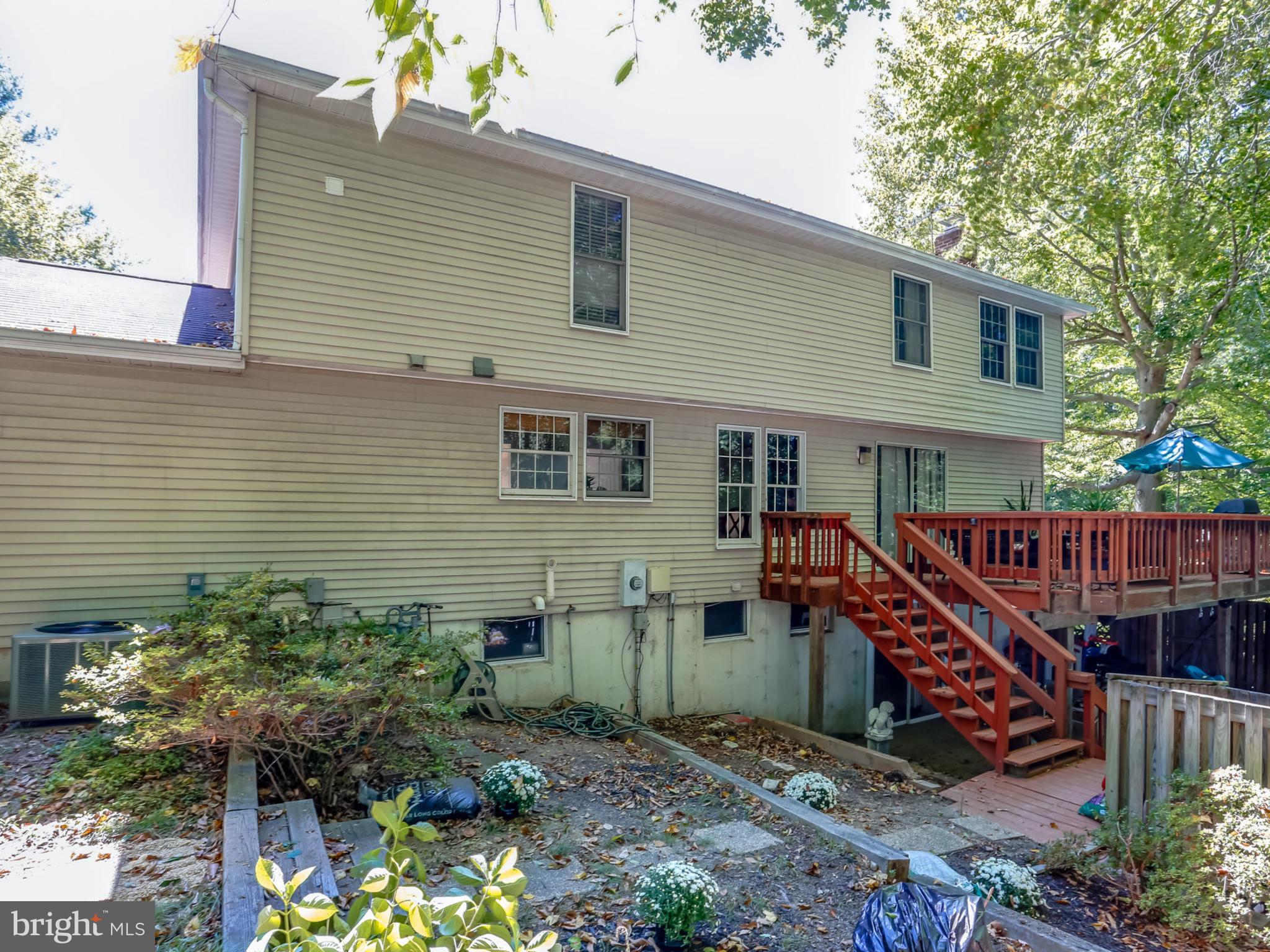 7817 Roundabout Way Springfield, VA 22153 - Photo 26 of 30 a view of a house with wooden deck front of house