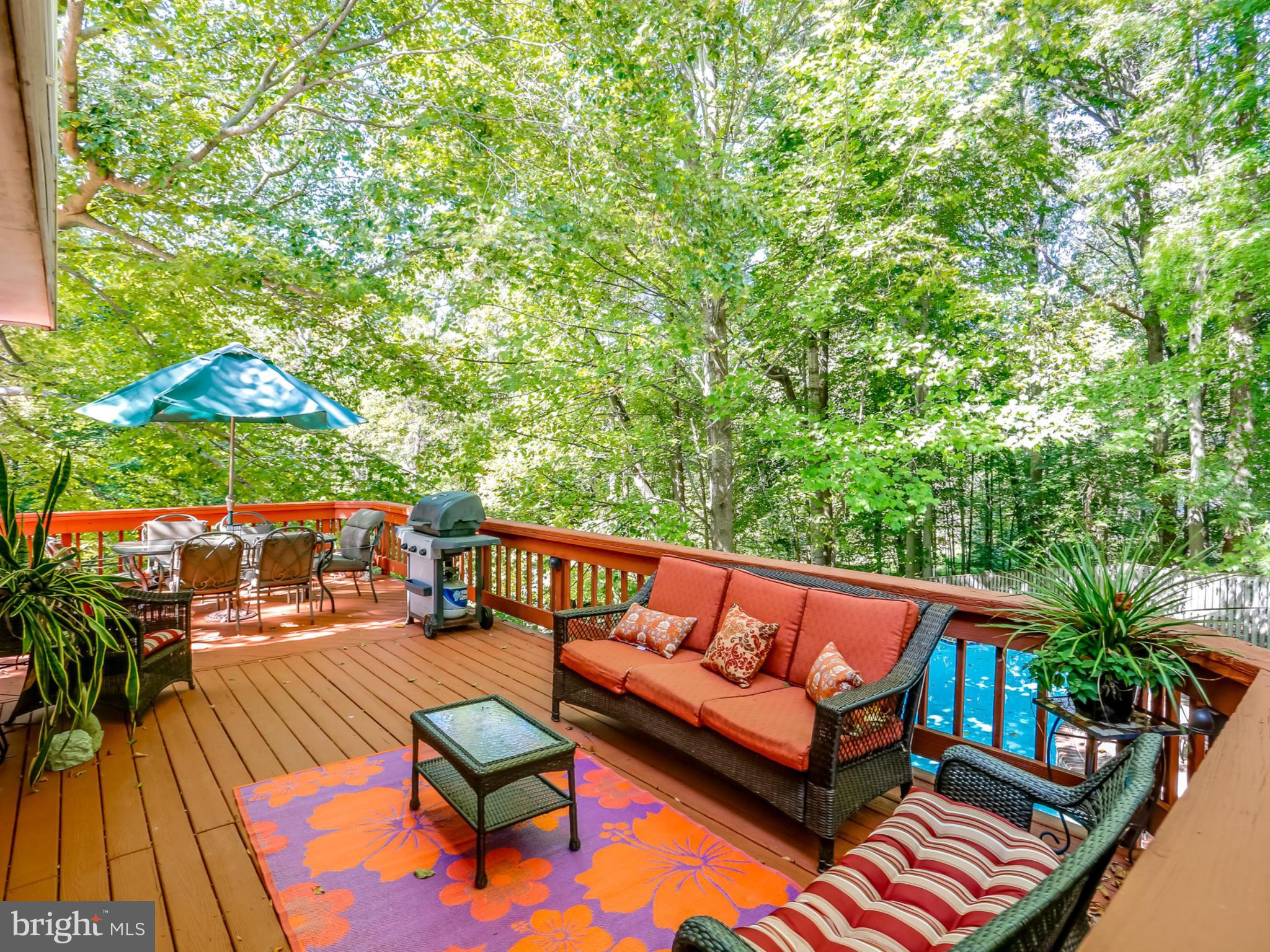 7817 Roundabout Way Springfield, VA 22153 - Photo 29 of 30 deck with furniture and umbrella