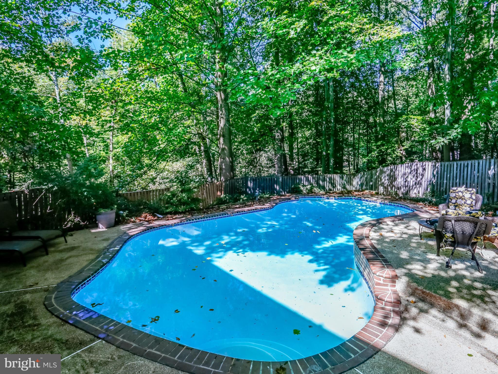 7817 Roundabout Way Springfield, VA 22153 - Photo 30 of 30 a view of a pool in a backyard