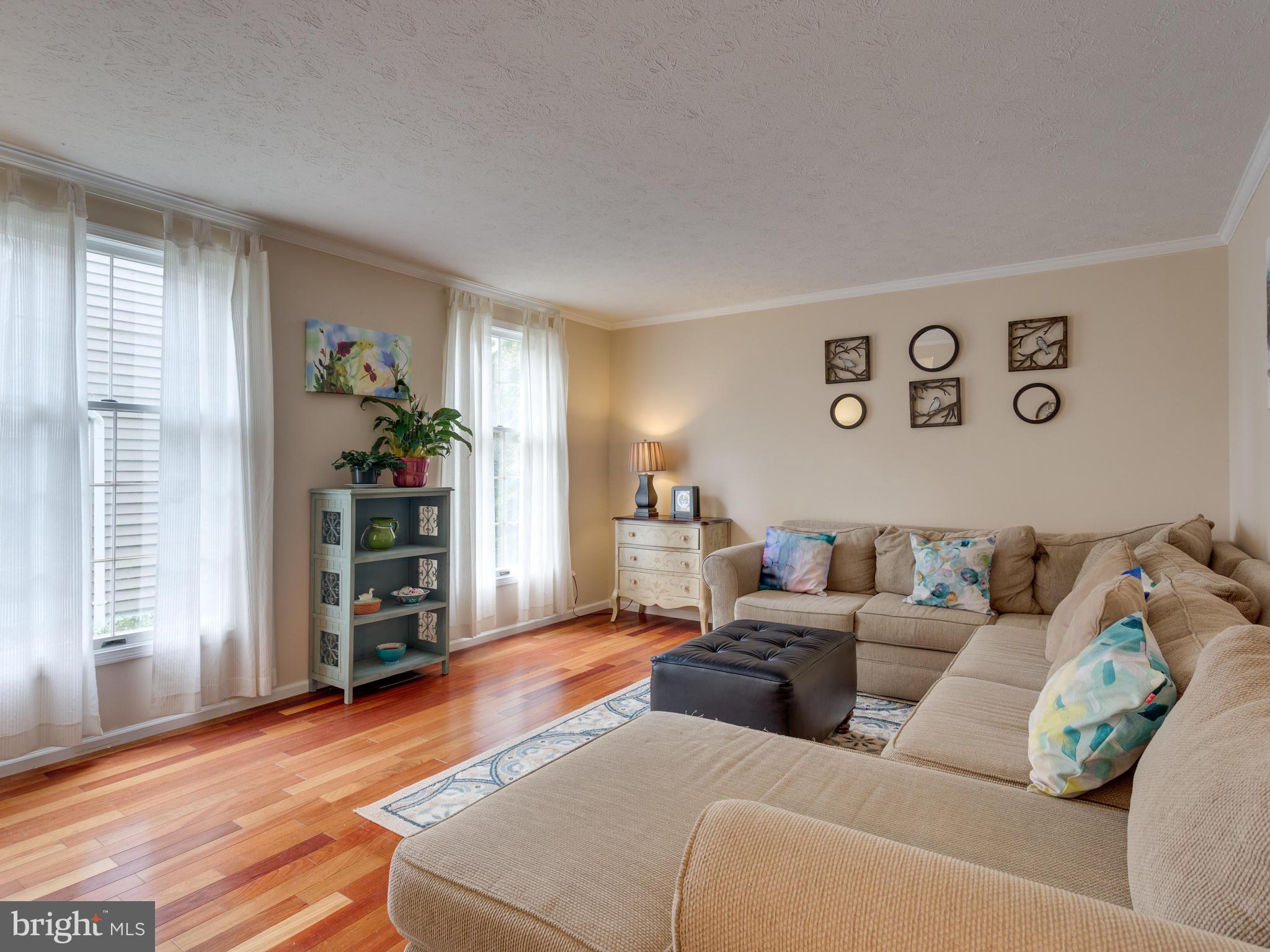 7817 Roundabout Way Springfield, VA 22153 - Photo 4 of 30 a living room with furniture and window with wooden floor
