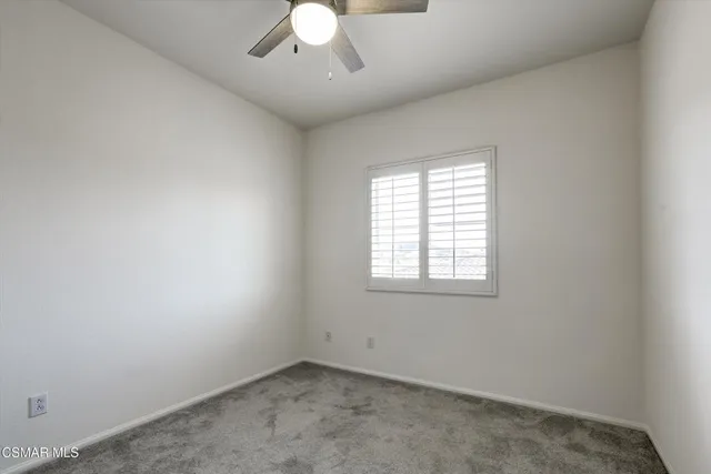 an empty room with closet area