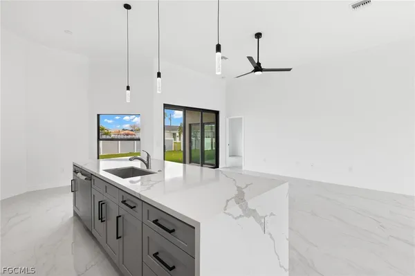 a kitchen with stainless steel appliances a sink and a stove